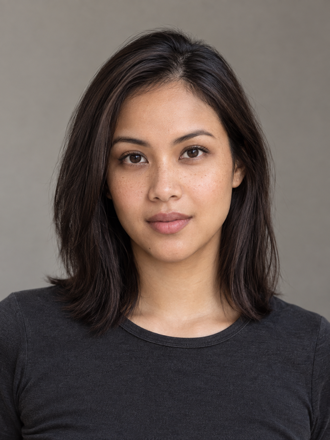 Fictional performer Aisha Rahman, natural studio headshot